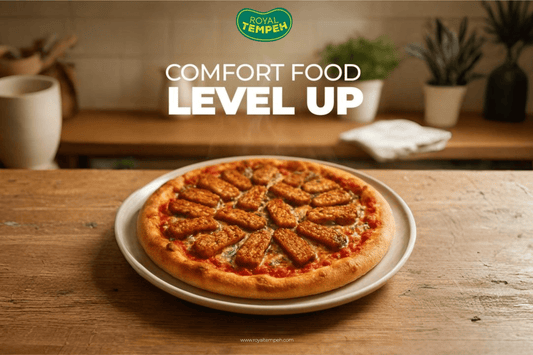 Tempeh pizza topped with golden tempeh slices, blending comfort food with a healthy twist.