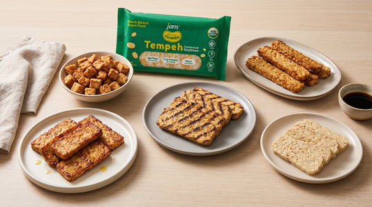 Plates displaying five different ways to prepare tempeh including pan-fried slices, grilled slabs with grill marks, crispy air-fried cubes, and raw blocks arranged around a green package of Jans Royal Tempeh Fermented Soybean