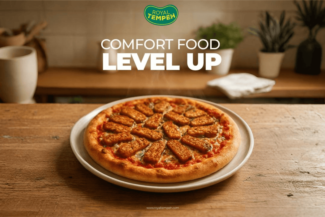 Tempeh pizza topped with golden tempeh slices, blending comfort food with a healthy twist.