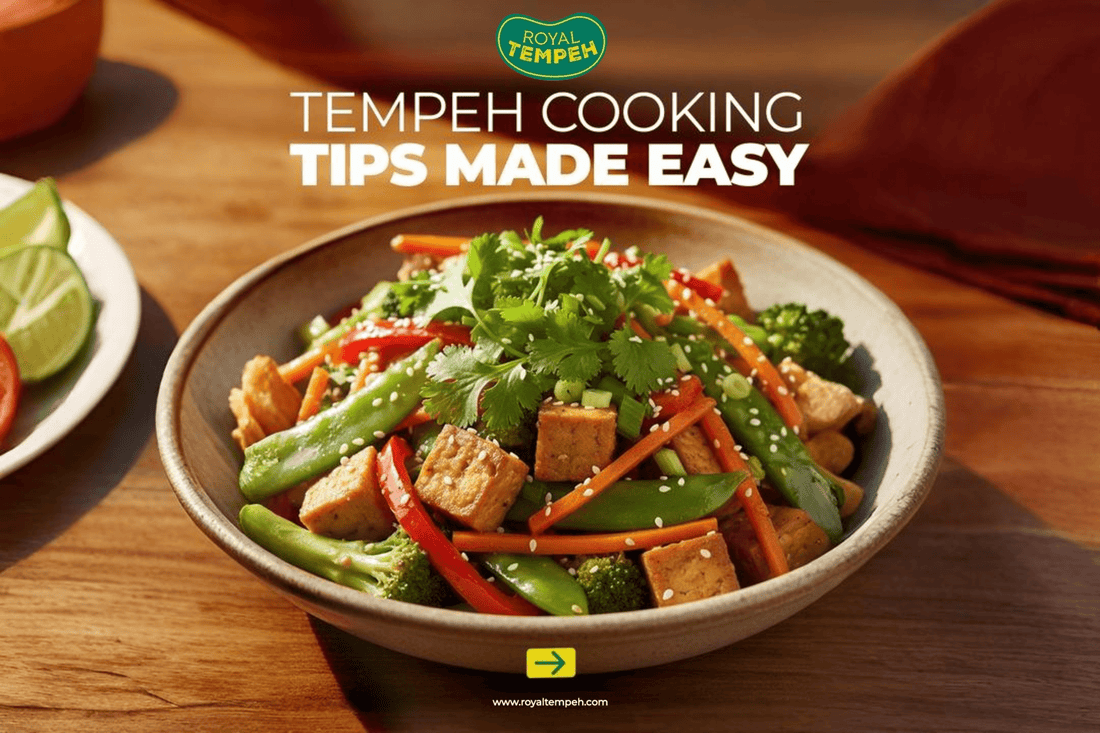 Stir-fried tempeh with fresh vegetables, topped with sesame seeds and cilantro in a bowl.