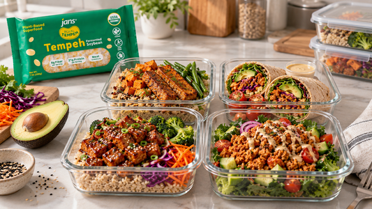 Glass meal prep containers filled with various balanced vegan lunches featuring Royal Tempeh, grains, and fresh vegetables alongside a package of Royal Tempeh.